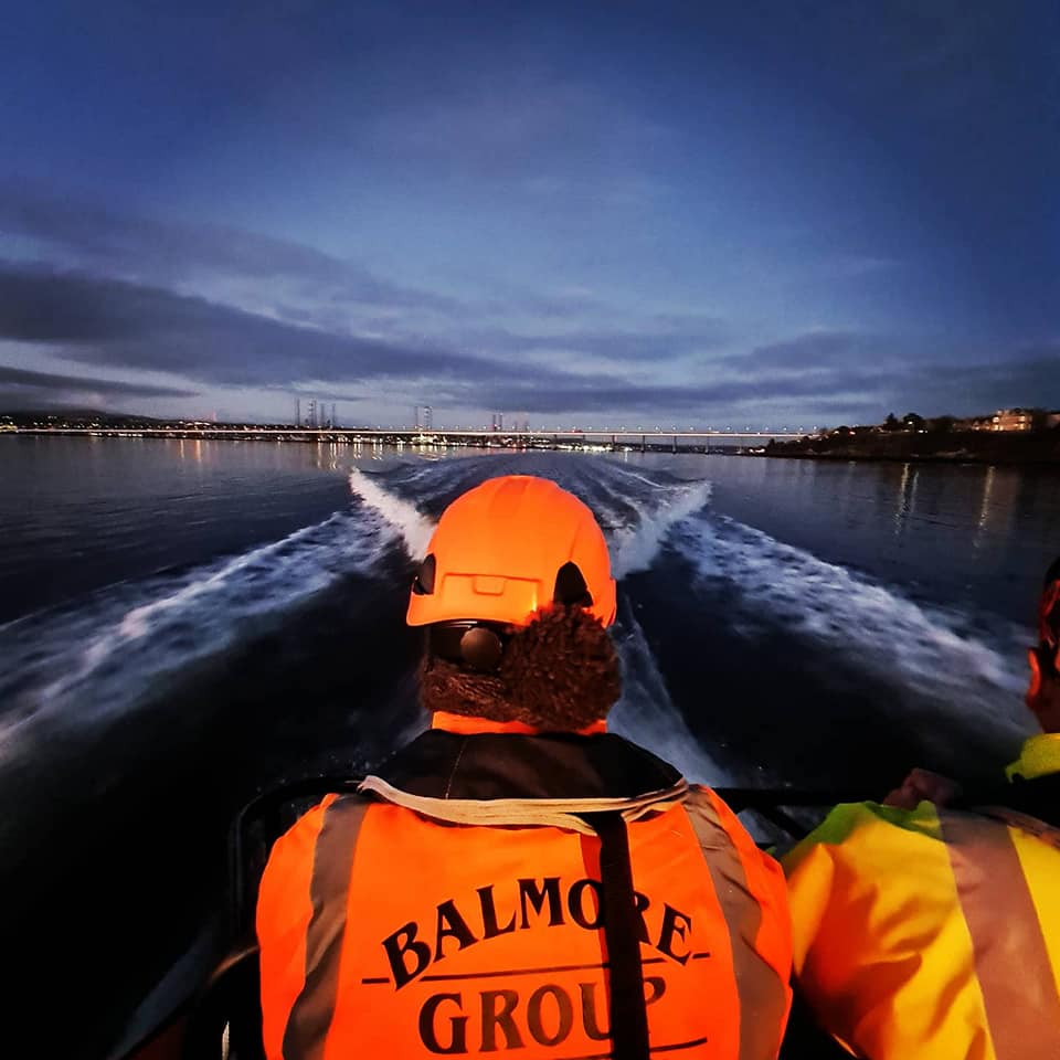 underwater drone inspection team working late at night